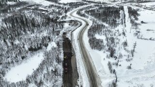 Snow boot - drone footage of a road in a snow covered landscape | Trending HD Video