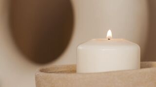 WallPics - 4K Wallpapers - lighted candle in a ceramic candle holder | Trending HD Video