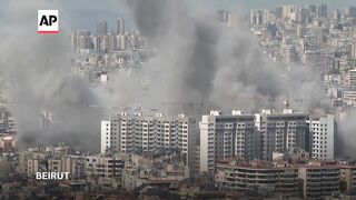 Explosion and plumes of smoke rising in Beirut following Israeli strike.
