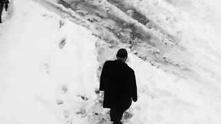 Winter Coat - lone figure walking on snowy path | Trending HD Video
