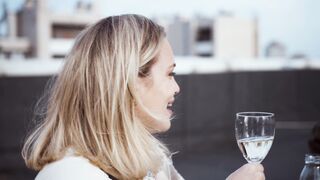 Funnyfuzzy - two women laughing and drinking wine together | Trending HD Video