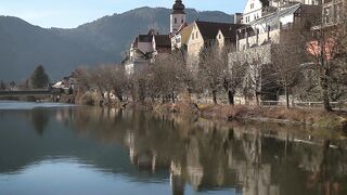 Wallpaper hanging - serene riverside village reflection at dawn | Trending HD Video
