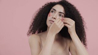 The Pioneer Woman - woman applying under eye patches on her face | Trending HD Video