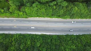 Moving Backgrounds 4k - WALLPS - aerial view of forest road with passing cars | Trending HD Vid