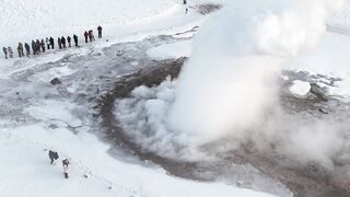 Winter solstice - aerial view of icelandic geyser eruption in winter | Trending HD Video