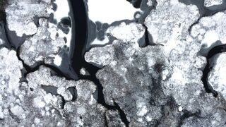 Winter solstice - aerial view of frozen river patterns in winter | Trending HD Video