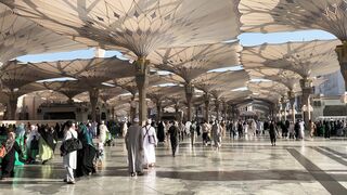 masjid al nabawi courtyard with pilgrims | Professional HD Video