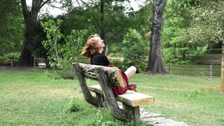 The Shy Snow Woman and the Cursed Ring - a woman sitting on a bench in a park | Trending HD Vid 2