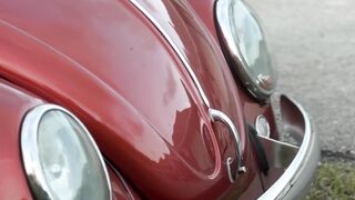 Electric car - vintage volkswagen beetles in a parking lot | Trending HD Video