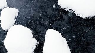 The Shy Snow Woman and the Cursed Ring - top view of snow covered rocks in a flowing creek | Tr