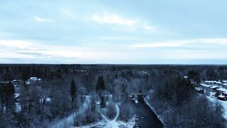 Winter solstice - aerial winter landscape of snowy forest and river | Trending HD Video