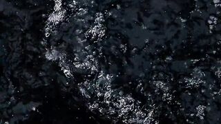 Winterhalter - snowflakes falling on a flowing creek | Trending HD Video