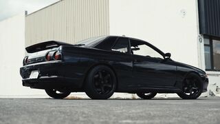 Carrefour - sleek black sports car parked outdoors | Trending HD Video