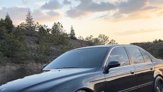 Electric car - a person taking a picture of the sunset on the road | Trending HD Video