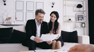 Funny Gift Ideas - close up footage of a couple reading a document | Trending HD Video