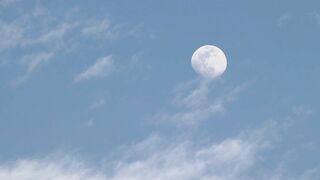 I Love Wallpaper - a full moon is seen in the sky over a building | Trending HD Video 2
