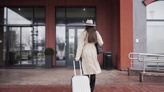 Woman - woman entering the hotel with suitcase | Trending HD Video