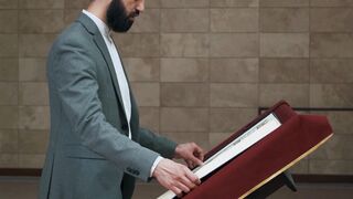 ALIEN STAGE the Art Book Deluxe Edition - man closing a book | Trending HD Video