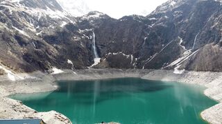 The Shy Snow Woman and the Cursed Ring - a lake in the mountains with snow on the ground | Tren