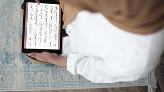 person reading koran on a tablet | Professional HD Video 2
