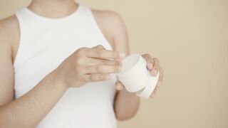 Woman - a woman applying facial cream | Trending HD Video