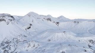 The Shy Snow Woman and the Cursed Ring - drone overview of icelandic snow covered mountains | T