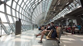 Travelon - modern airport terminal with passengers waiting | Trending HD Video