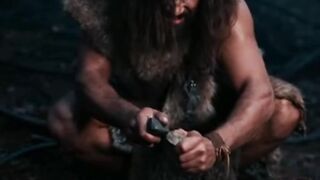 Stone age man burning fire