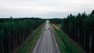 Carrefour - a red car driving on the road | Trending HD Video