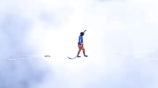 Walking a Tightrope Between Mountains