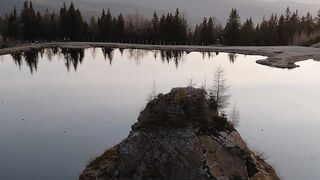 Wallpaper hanging - serene reflections at sunset on tranquil lake | Trending HD Video