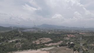 4K Computer Monitor - scenic drone view of wind farm in vietnam hills | Trending HD Video
