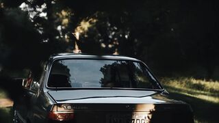 Carrefour - vintage car in shadowy forest setting | Trending HD Video