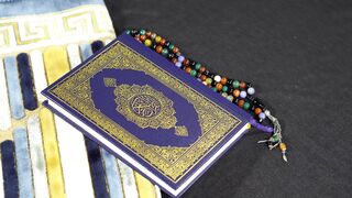 close up of the quran and a colorful rosary | Professional HD Video