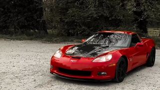 Electric car - red sports car in scenic outdoor parking lot | Trending HD Video