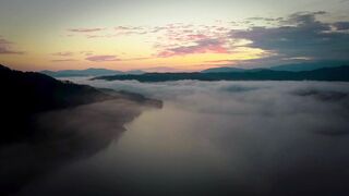4K Computer Monitor - a sunset over a lake with fog | Trending HD Video