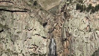 Travel Backpack - waterfalls in between mountain | Trending HD Video