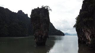 travelite - drone video of ko ta pu islet under a cloudy sky | Trending HD Video