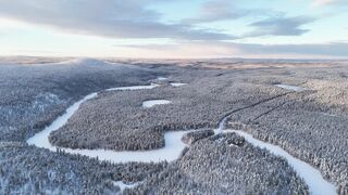 4K Computer Monitor - aerial view of snowy finnish winter landscape | Trending HD Video