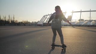 The Shy Snow Woman and the Cursed Ring - young woman skateboarding at sunset outdoors | Trendin