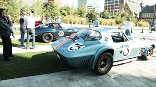 Cartier - slow motion footage of people looking into race cars on display outdoor | Trending HD