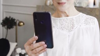 Funnyfuzzy - a woman looking at her phone | Trending HD Video