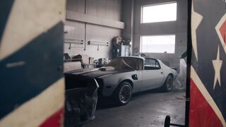 Carpet - a car is parked in a garage with a flag | Trending HD Video