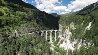 4K resolution - aerial view of swiss landwasser viaduct with train | Trending HD Video