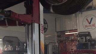 Electric car - a man is working on a car in a garage | Trending HD Video 2