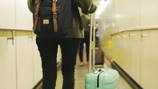 The Shy Snow Woman and the Cursed Ring - a woman walking in a passenger boarding bridge | Trend