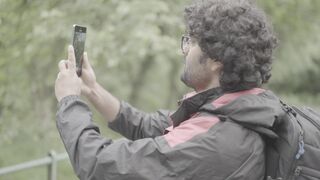 Travel Backpack - man taking video on his smartphone | Trending HD Video