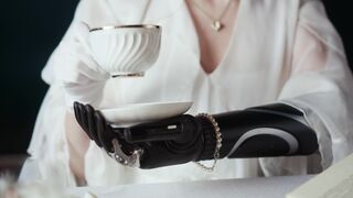 Funnyfuzzy - female with prosthetic arms drinking tea | Trending HD Video