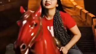 Beautiful girl from Bangladesh is running with a horse