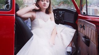 Carpet - teenager in wedding dress sitting on red car | Trending HD Video